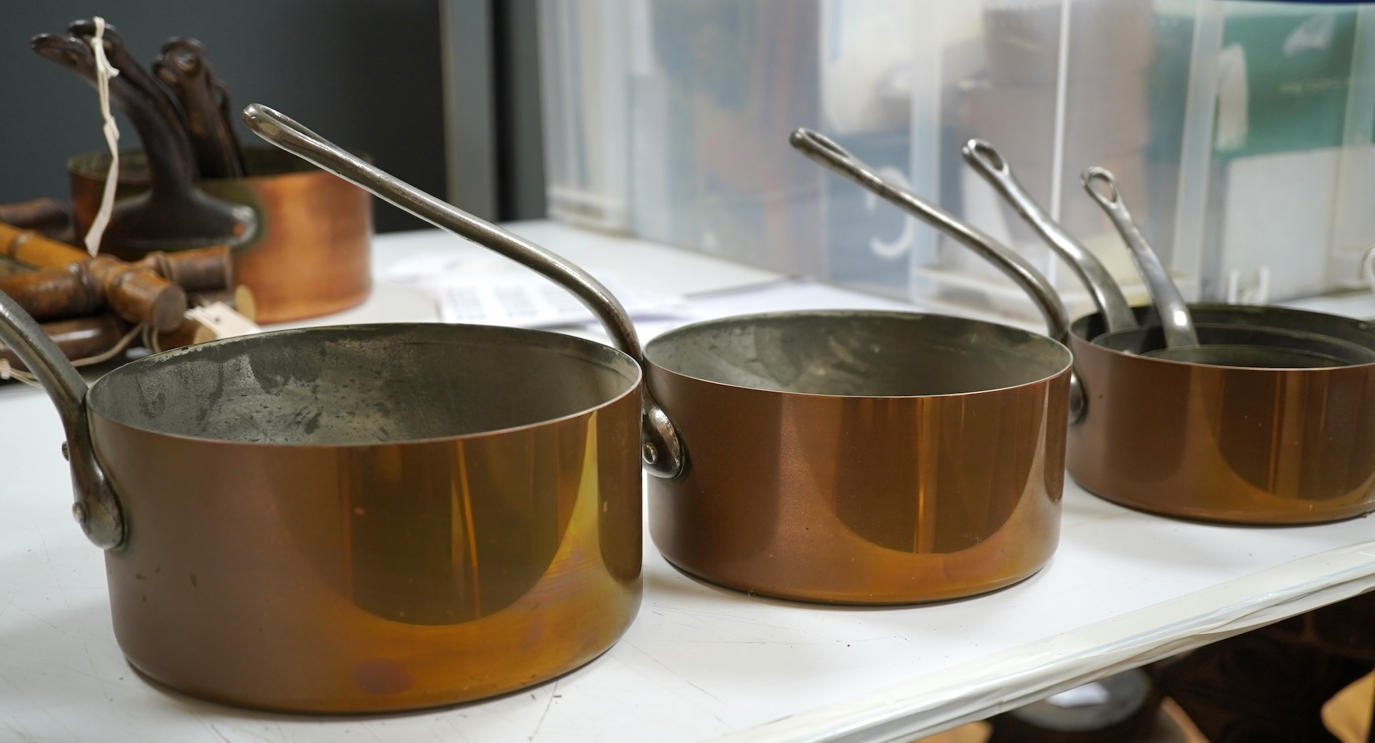 A graduated set of five French copper pans